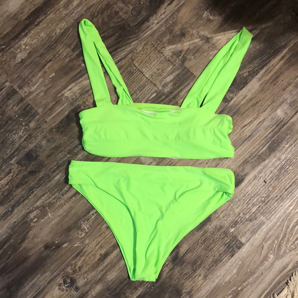 Lime green bikini with high cut bottoms.